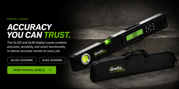 Grettz digital levels banner — Grettz GL120 digital spirit level with backlit LCD angle display resting on a concrete step beside its padded carry case, headline 'Accuracy You Can Trust'